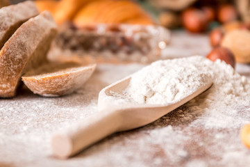 At the bakery, using flour for baking
