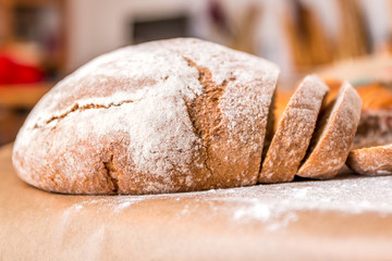 Loaf of bread with flour in a bakery