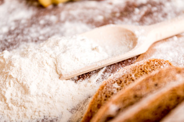 At the bakery, using flour for baking