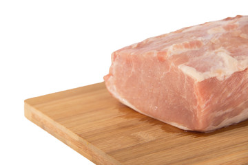 Raw piece of meat on a wooden board on a white background