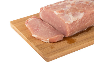 Raw piece of meat on a wooden board on a white background