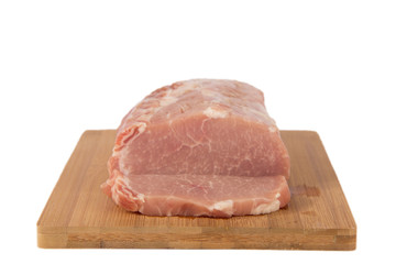 Raw piece of meat on a wooden board on a white background