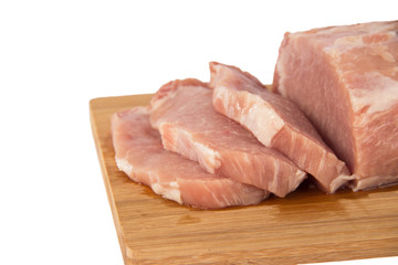 Raw piece of meat on a wooden board on a white background