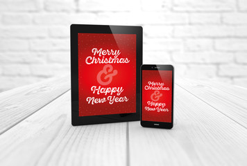 Christmas greeting on tablet and smart phone