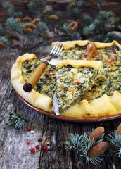 Spinach quiche and pine branches
