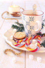 Cup of coffee milk and christmas sugar cookies