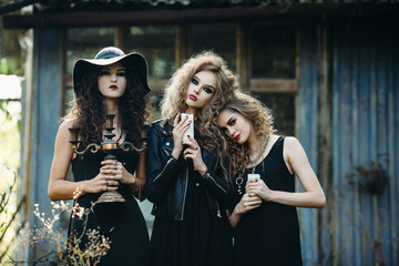 three vintage women as witches