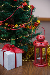 Christmas celebration things: firtree with gifts under it, decor