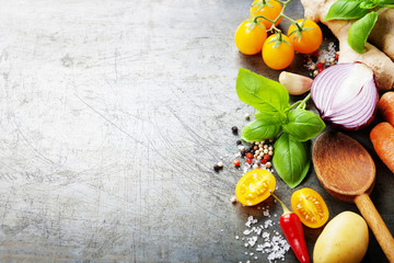 Wooden spoon and fresh organic vegetables on old background - obrazy, fototapety, plakaty
