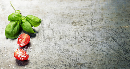Wooden spoon and fresh organic vegetables on old background