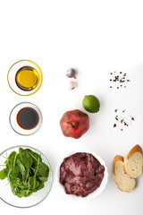 Ingredients for salad with chicken liver and spinach  vertical