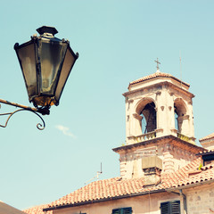 Fototapeta na wymiar View of Old Tower and Street Lantern