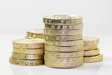 Piles of British Pound Coins (with reflection)
