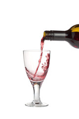 Red wine being poured into a wine glass