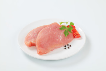 Raw turkey breast steaks