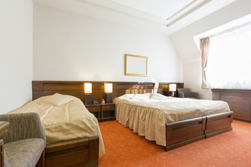 Fototapeta na wymiar Interior of a hotel bedroom in the morning, sunlight