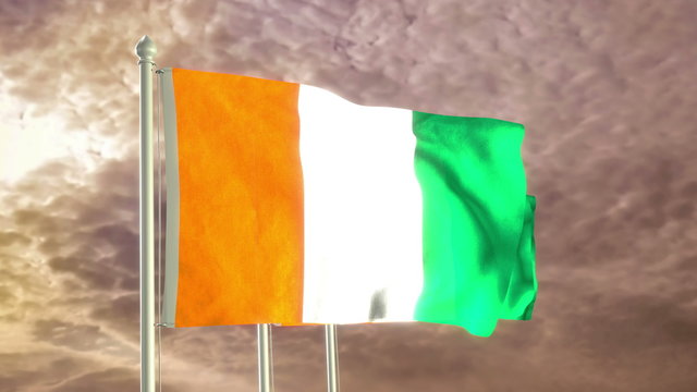 Three flags of Ivory Coast waving in the wind (4K high detailed 3D render) with a dramatic sky in the background