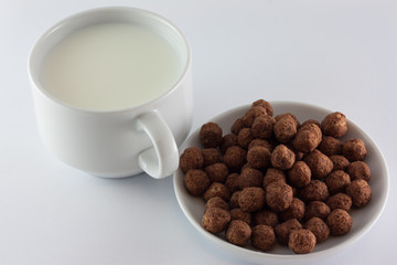 Milk and sweets. / Milk and sweets. Fresh milk with delicious sweets on a light background.