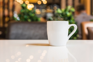 white coffee cup in coffee shop