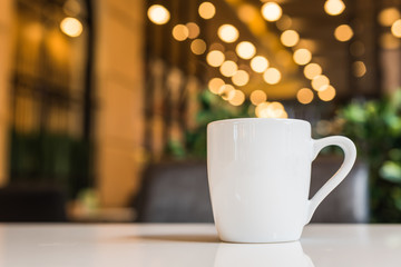 white coffee cup in coffee shop