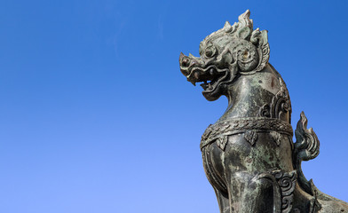 Fototapeta na wymiar Metal Lion Statue At Door Front 