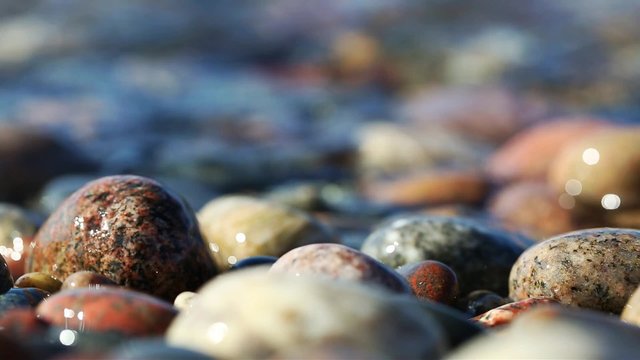 Lake Superior Stones on Beach - Waves ebb back and forth over colorful beach stones at Crisp Point in the Upper Peninsula of Michigan
