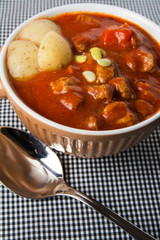 casserole with meat stew and tomato sauce