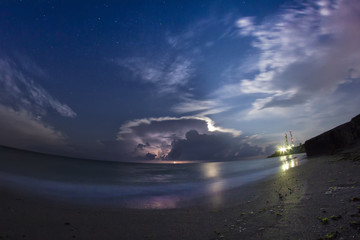 Storm with clouds and lightning over the sea