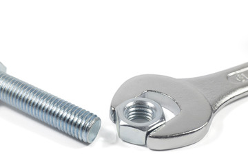 Metal Bolt And Chrome-Vanadium Spanner Gripping Nut Isolated