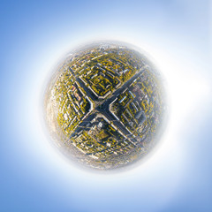 Aerial city view with crossroads, roads, houses, buildings and parks