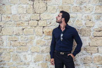 Gorgeous Young Elegant Man Against Old Wall