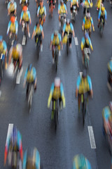 bicycle race , group of people on bikes - motion blur abstract