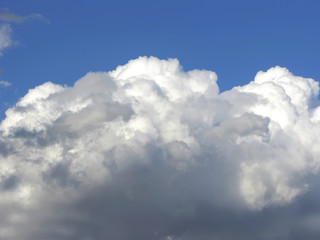 Blue sky with fluffy white clouds in day light