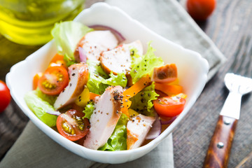 Salad of vegetables and smoked chicken