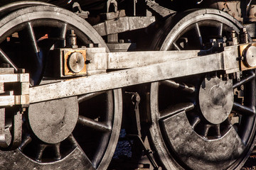 Detail of steam train engine wheels and engineering, transport and heavy industry