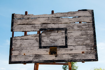 Basketball hoop is broken and wood board damaged ,Shiny wooden basketball