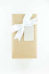 Top view of  Wrapped vintage gift box with white ribbon bow. Gift for Special Day
