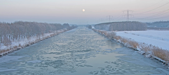 Sunrise over a canal in winter