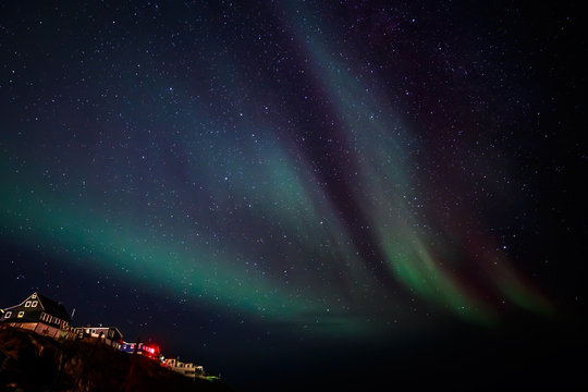 Greenlandic Northern lights over Nuuk city