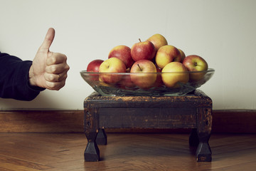 Apples with thumb up