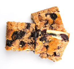 Portions of blueberry sponge cake over white background