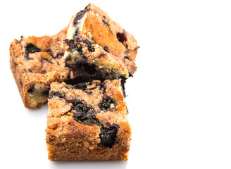 Portions of blueberry sponge cake over white background