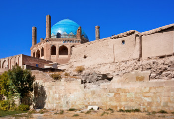 Stone walls built in 14 century and mausoleum Dome of Soltaniyeh, Iran. UNESCO World Heritage Site