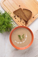 Cream of mushroom soup and bread, top view