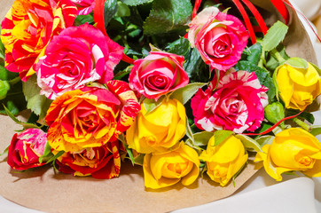 Bouquet of  pink, yellow, orange and red fresh roses