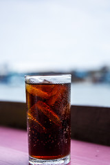 Coca Cola in a glass of water.