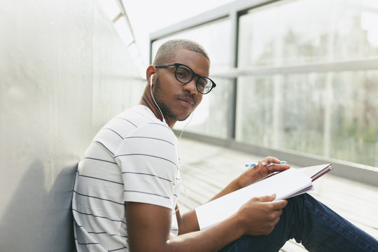 Young Afro-American man studying language