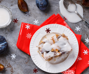Plum cake in white icing for Christmas and New year