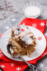 Plum cake in white icing for Christmas and New year