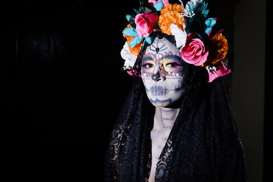 Woman dressed as La Calavera Catrina, Traditional Mexican female skeleton figure symbolizing death